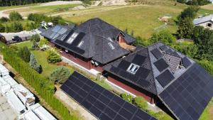 an overhead view of a house with solar panels on it at Premium Residence SPA & Garden in Glińcz