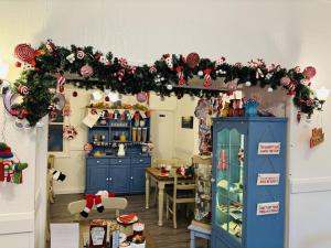 a kitchen with a christmas decoration on the wall at Carnson House in Penzance