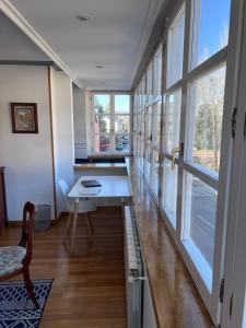 a room with a desk and a large window at Casa la Plaza in Molinaseca +24 photos