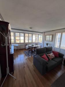 a living room with a couch and a table at Casa la Plaza in Molinaseca
