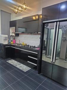 a kitchen with a sink and a counter at CT Villa 212 in Solok Belimbing