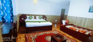 Postel nebo postele na pokoji v ubytování Kevins Bearshola Residency
