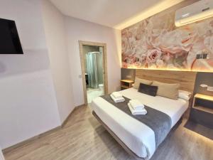 Postel nebo postele na pokoji v ubytování Feeling Home - Suites&Rooms