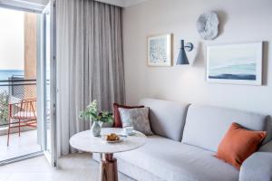 a living room with a couch and a table at Amadria Park Grand Hotel 4 Opatijska Cvijeta in Opatija