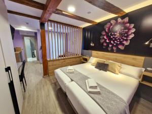 Postel nebo postele na pokoji v ubytování Feeling Home - Suites&Rooms