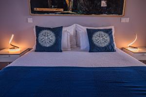 Кровать или кровати в номере Buganvilias Do Meco Guest house