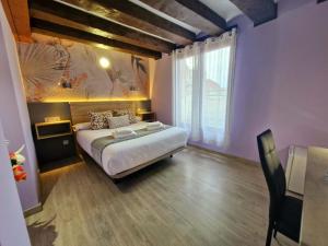 Postel nebo postele na pokoji v ubytování Feeling Home - Suites&Rooms