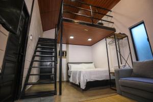 Casa Damai Janda Baik - RIVERVIEW TINY HOUSE客房内的一张或多张床位