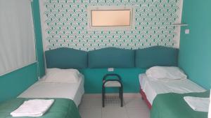 Ένα ή περισσότερα κρεβάτια σε δωμάτιο στο Hotel El Pasaje
