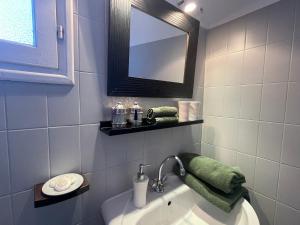 a bathroom with a tub and a mirror and a sink at Les Hortensias in Espoey +92 photos