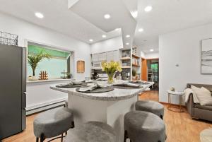 a kitchen with a large island in the middle of a room at Hidden Haven in Traverse City