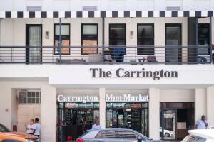 a building with a car parked in front of it at The Carrington Aparthotel by Totalstay in Cape Town