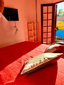 Ένα ή περισσότερα κρεβάτια σε δωμάτιο στο Falanga Suítes 1 +14 φωτογραφίες