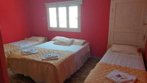 Ένα ή περισσότερα κρεβάτια σε δωμάτιο στο Hotel El Pasaje