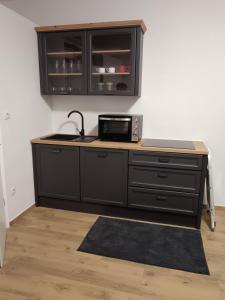 Kuchyň nebo kuchyňský kout v ubytování Urko Apartments Ljubljana