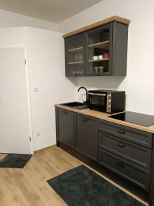 Kuchyň nebo kuchyňský kout v ubytování Urko Apartments Ljubljana