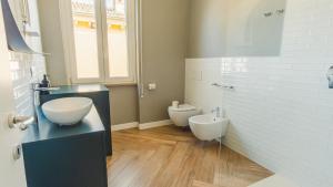 a bathroom with a sink and a toilet at The Roman Villa View - Italian Homing in Desenzano del Garda +16 photos