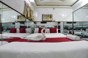 Postel nebo postele na pokoji v ubytování Sun Guest House