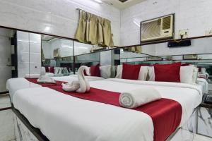 Postel nebo postele na pokoji v ubytování Sun Guest House