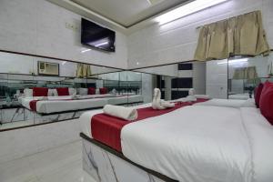 Postel nebo postele na pokoji v ubytování Sun Guest House
