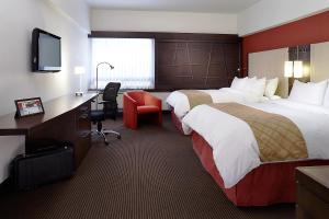 Ліжко або ліжка в номері Hotel Ruby Foo's