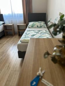 Łóżko lub łóżka w pokoju w obiekcie Pensjonat Zatoka 17