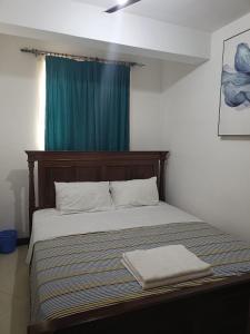 Giường trong phòng chung tại Calitwapa Studios Mtwapa