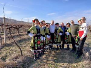 a group of people posing for a picture in a vineyard at Винарна-Славовица in Kalugerovo