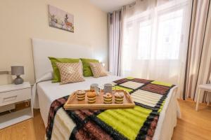 A bed or beds in a room at Apartamento Centro Santiago