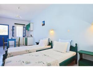 Postel nebo postele na pokoji v ubytování Hotel Glaros Karpathos