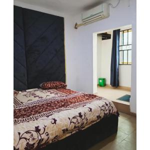 Postel nebo postele na pokoji v ubytování Jeymax Hotel and Suite