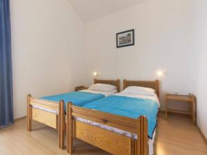 Postel nebo postele na pokoji v ubytování Apartments Pletikosa Gaj