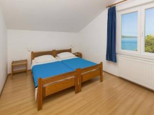 Postel nebo postele na pokoji v ubytování Apartments Pletikosa Gaj