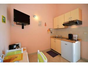 Kuchyň nebo kuchyňský kout v ubytování Apartments Sunce