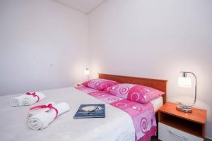 Postel nebo postele na pokoji v ubytování Family Apartments & Rooms Mikelin