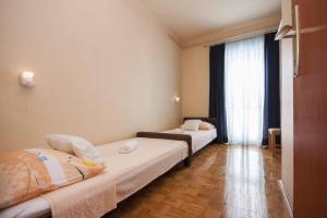Postel nebo postele na pokoji v ubytování Apartments Zdenka