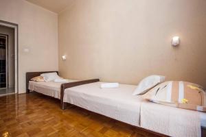 Postel nebo postele na pokoji v ubytování Apartments Zdenka