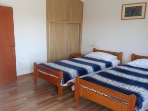 Postel nebo postele na pokoji v ubytování Apartments Pletikosa Gaj