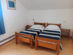 Postel nebo postele na pokoji v ubytování Apartments Pletikosa Gaj
