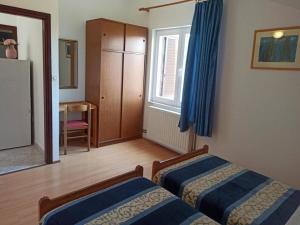 Postel nebo postele na pokoji v ubytování Apartments Pletikosa Gaj