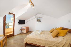 Posteľ alebo postele v izbe v ubytovaní Apartments Kaina