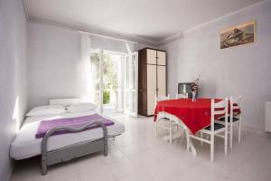 Postel nebo postele na pokoji v ubytování Apartments Zdenka