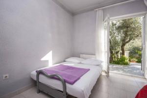 Postel nebo postele na pokoji v ubytování Apartments Zdenka + 13 fotografií