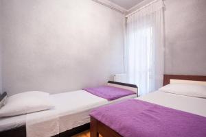Postel nebo postele na pokoji v ubytování Apartments Zdenka