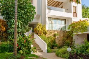 a house with a staircase in front of it at Waterfront Residences in Mombasa +4 photos