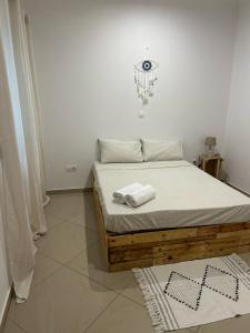 Ένα ή περισσότερα κρεβάτια σε δωμάτιο στο Kubiku Guest House