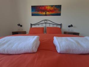 Llit o llits en una habitació de Sensi Hotel