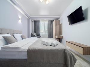 Postel nebo postele na pokoji v ubytování Hotel Paris