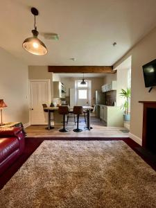 a living room with a couch and a table at The Farmhouse Snug in Spean Bridge