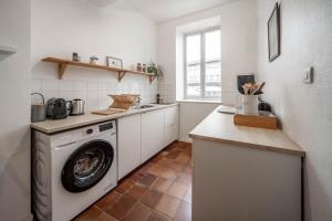 Kuchyň nebo kuchyňský kout v ubytování L'appartement Cosy + 7 fotografií